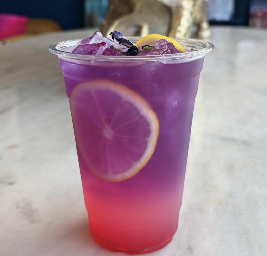 Electric Lemon: a violet-to-pink layered lemonade with a lemon slice
